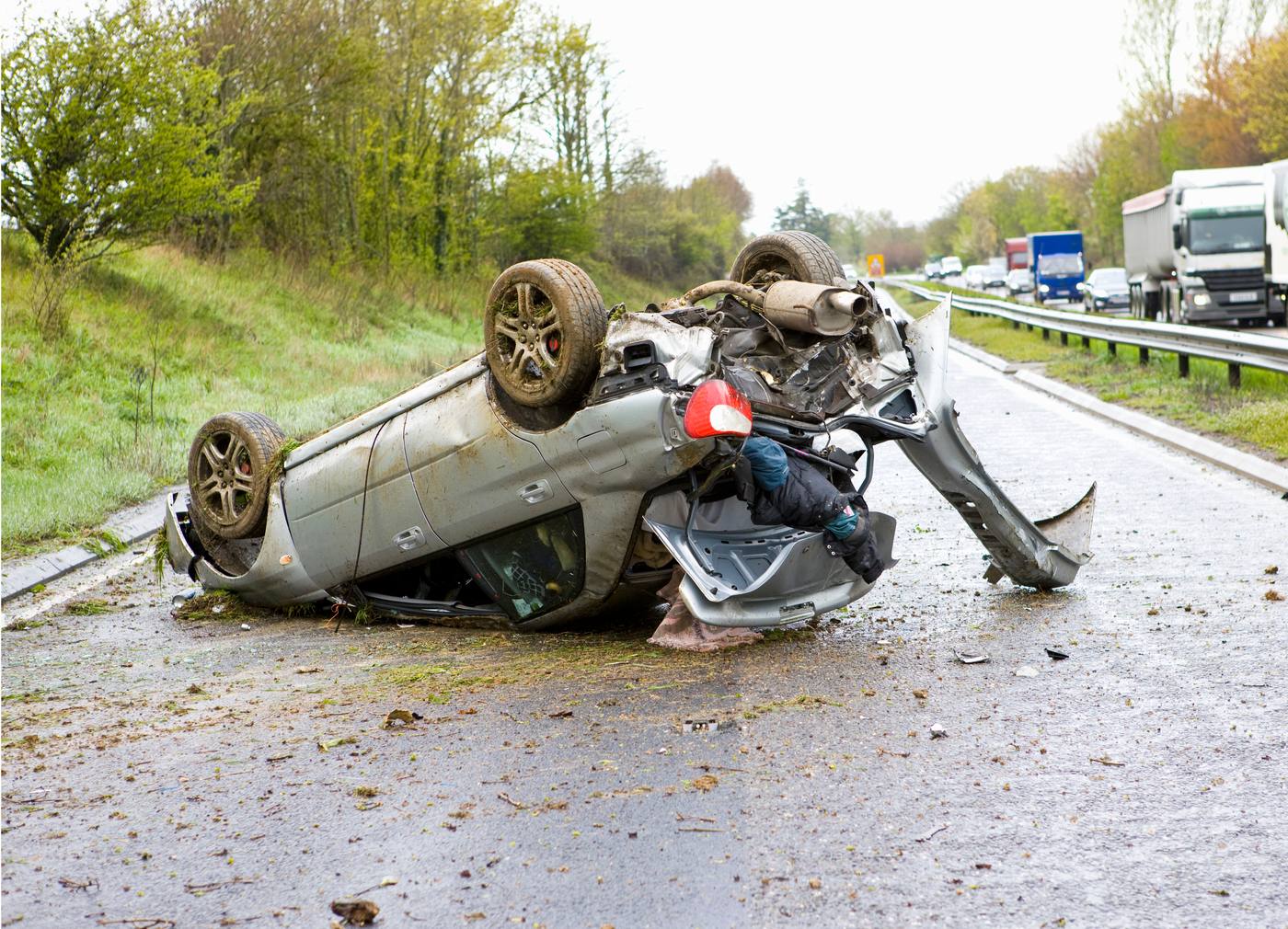 Car accident on a Colorado road with visible vehicle damage