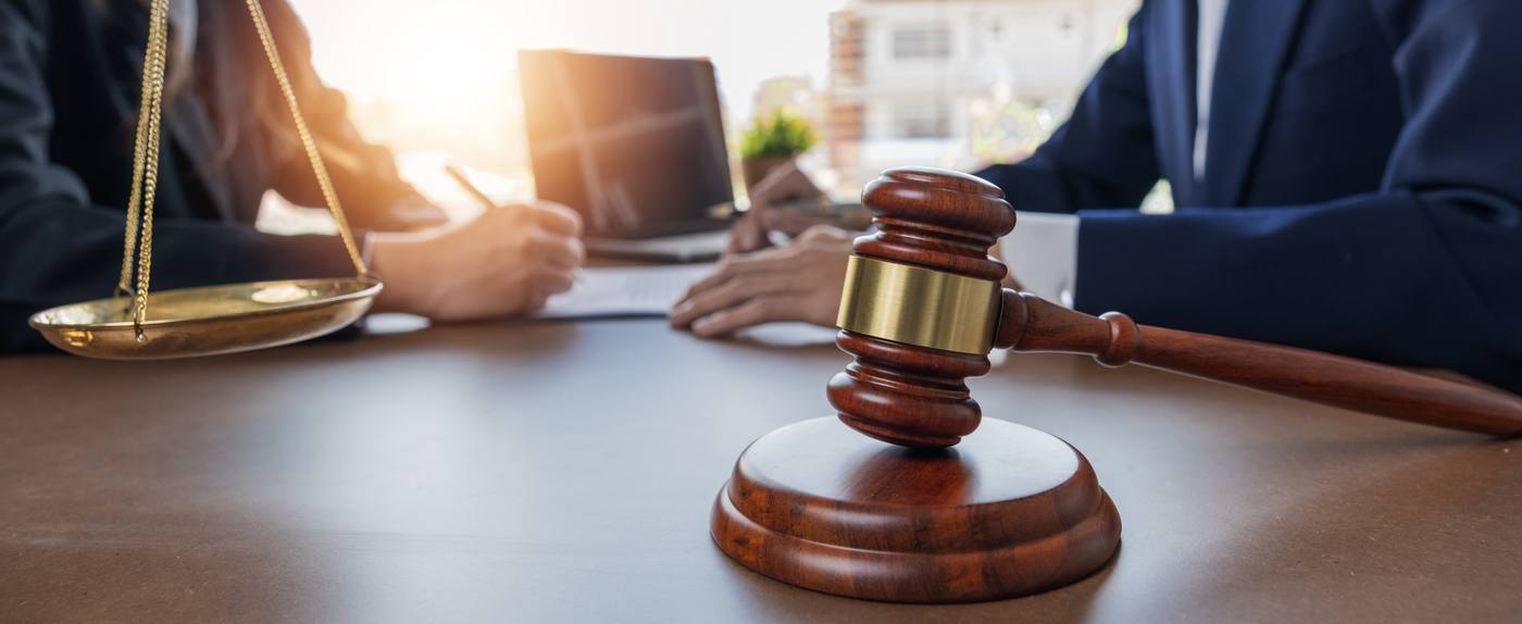 Client and attorney discussing legal fees during a consultation