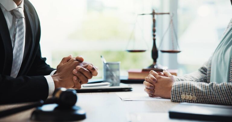 Attorneys in a law firm discussing a personal injury case
