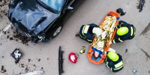 Emergency medical team attending to a car crash victim in Colorado