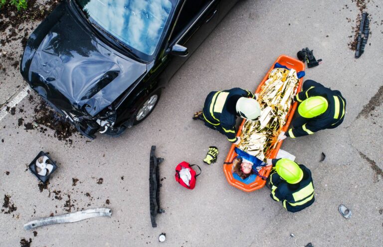 Emergency medical team attending to a car crash victim in Colorado