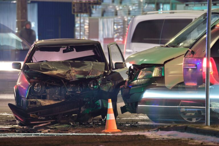 Damaged vehicles after a heavy collision on a Colorado road