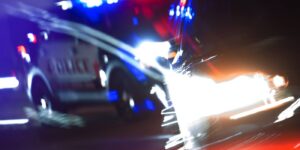 Police pursuit at night, illustrating hit-and-run UM claims