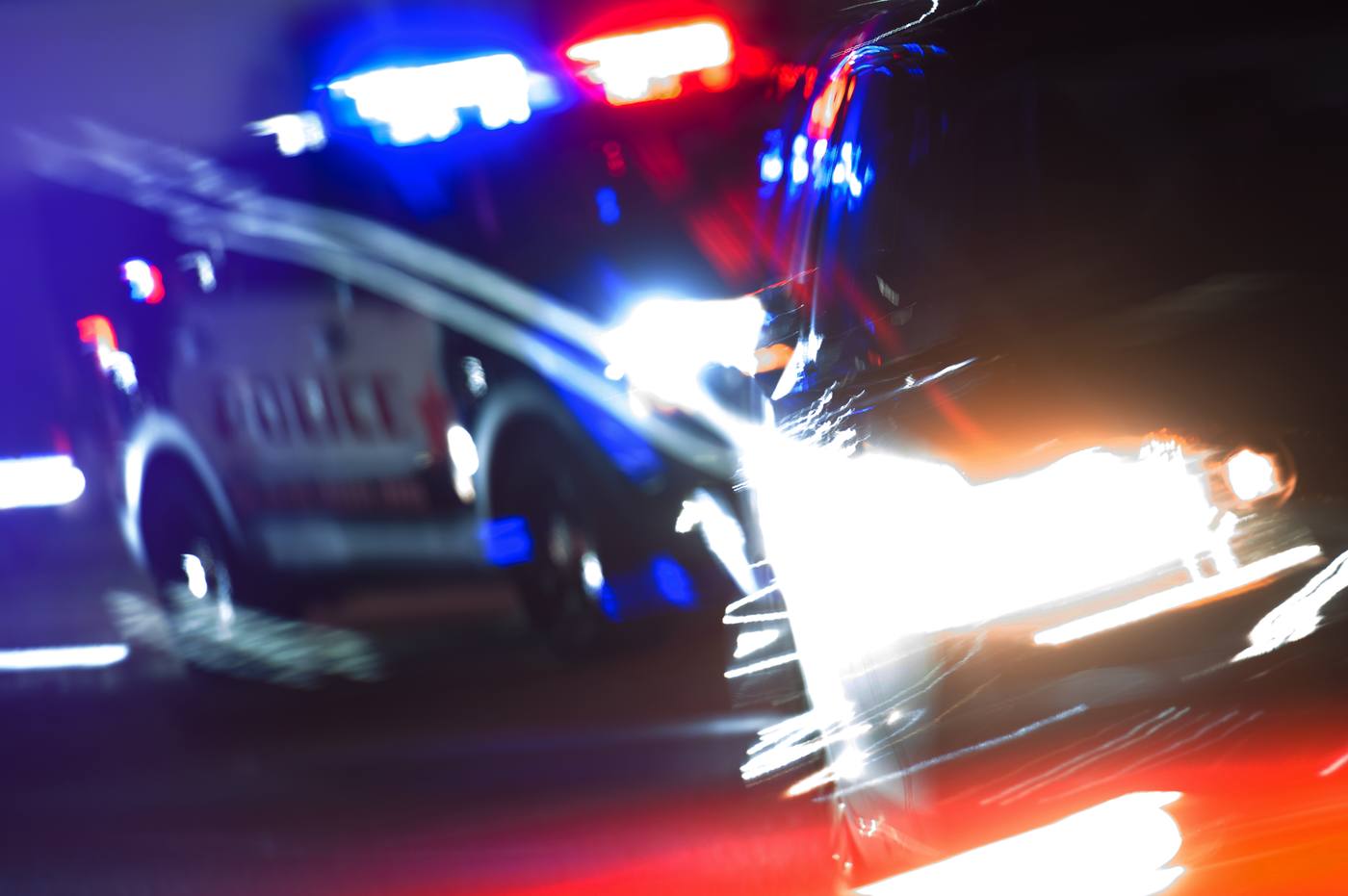 Police pursuit at night, illustrating hit-and-run UM claims