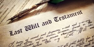 Last will and testament document with a quill pen