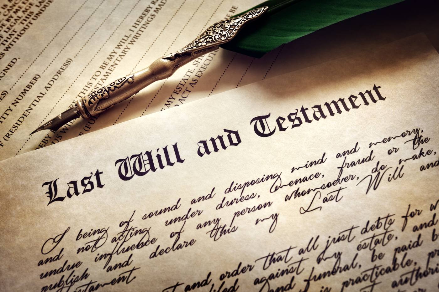Last will and testament document with a quill pen
