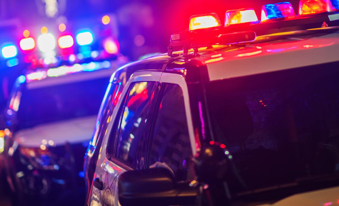 Police lights at a nighttime accident scene