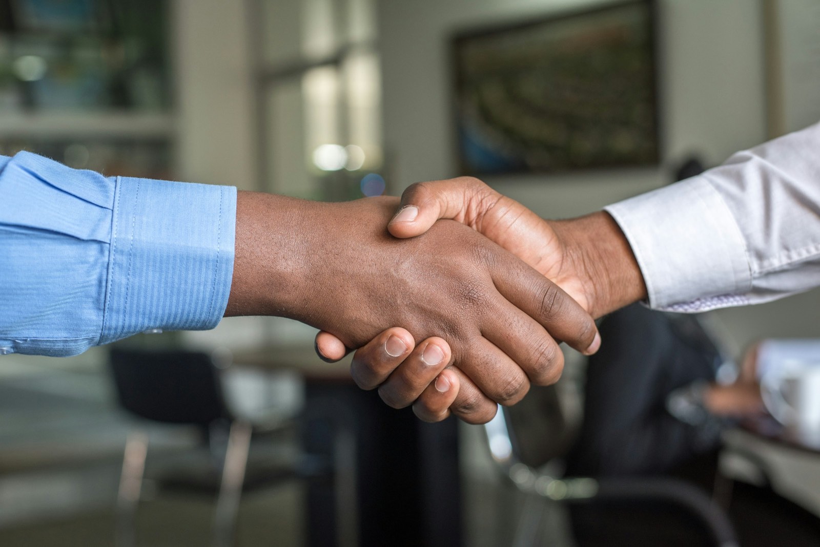 Attorney and client shaking hands after reaching an agreement